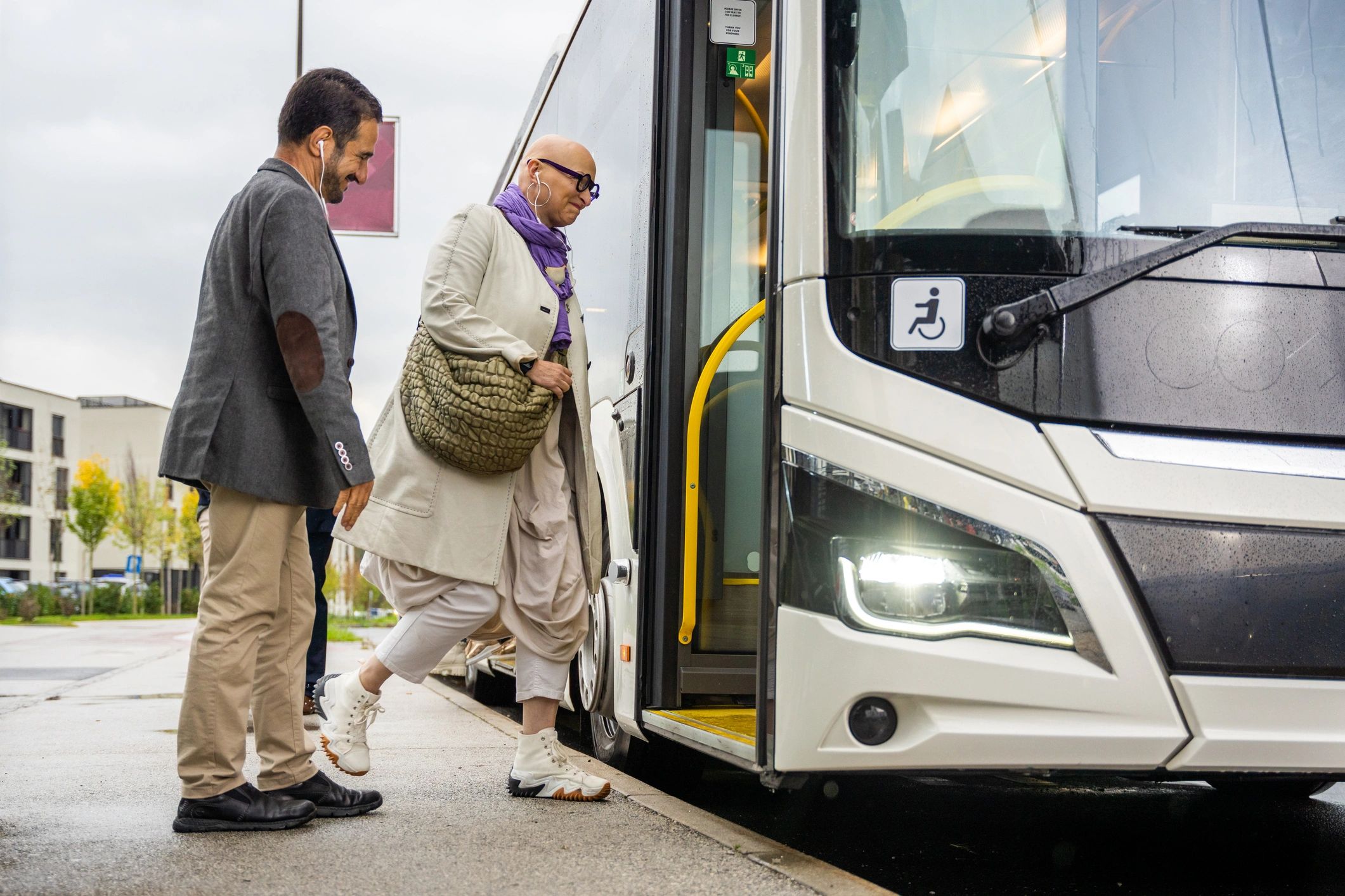 Passengers boarding a shuttle bus