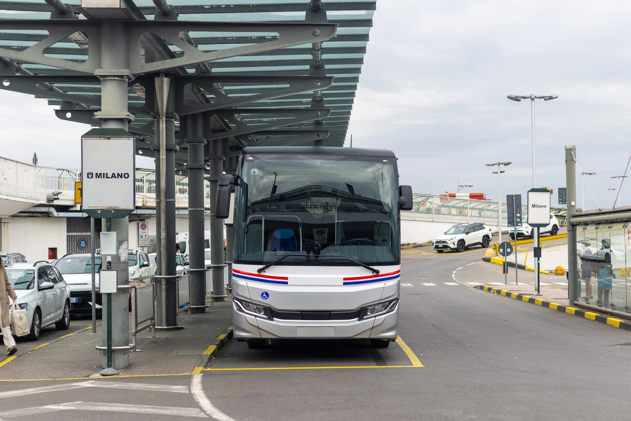 Bus parked outside an airport terminal