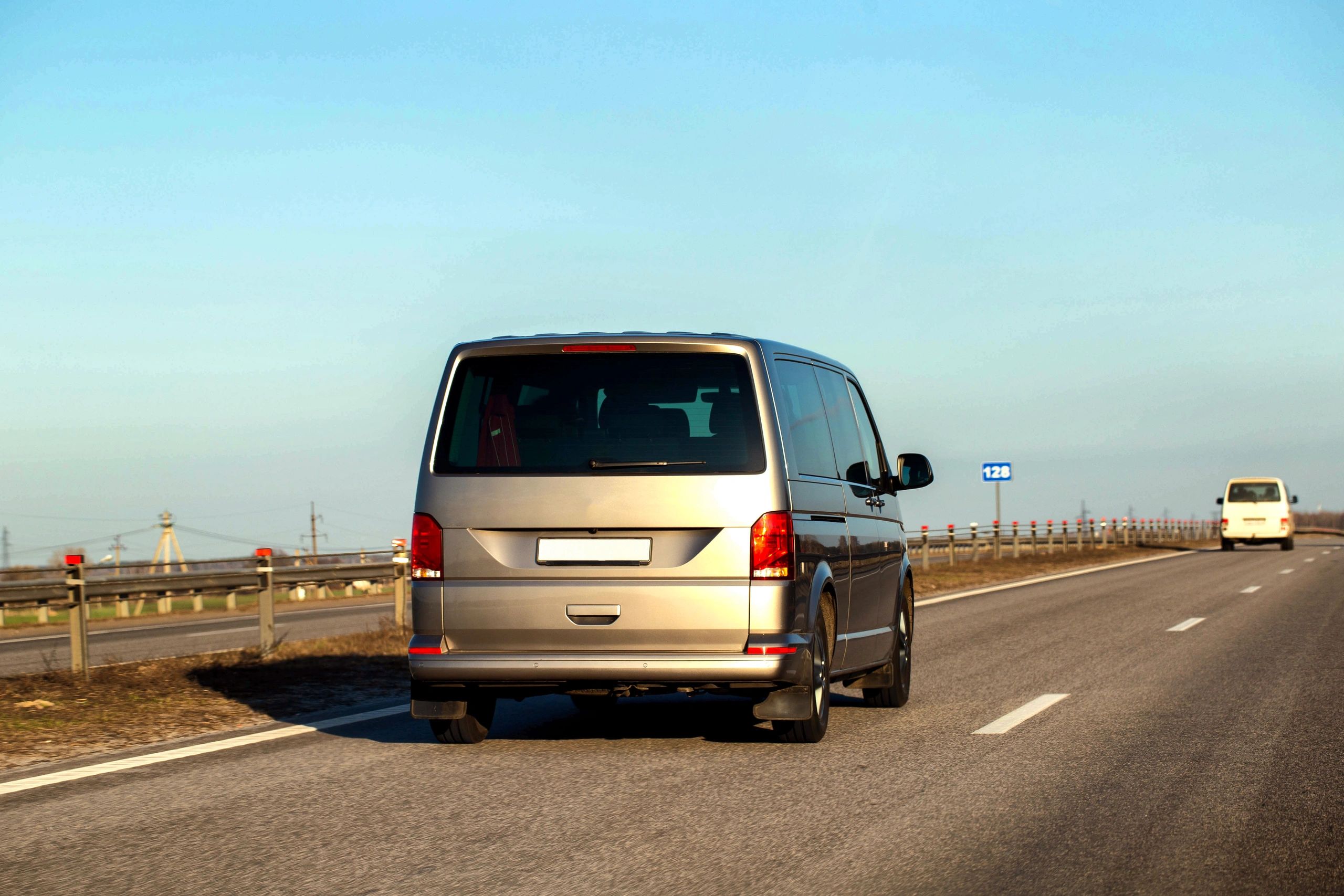 Executive shuttle van traveling on a highway